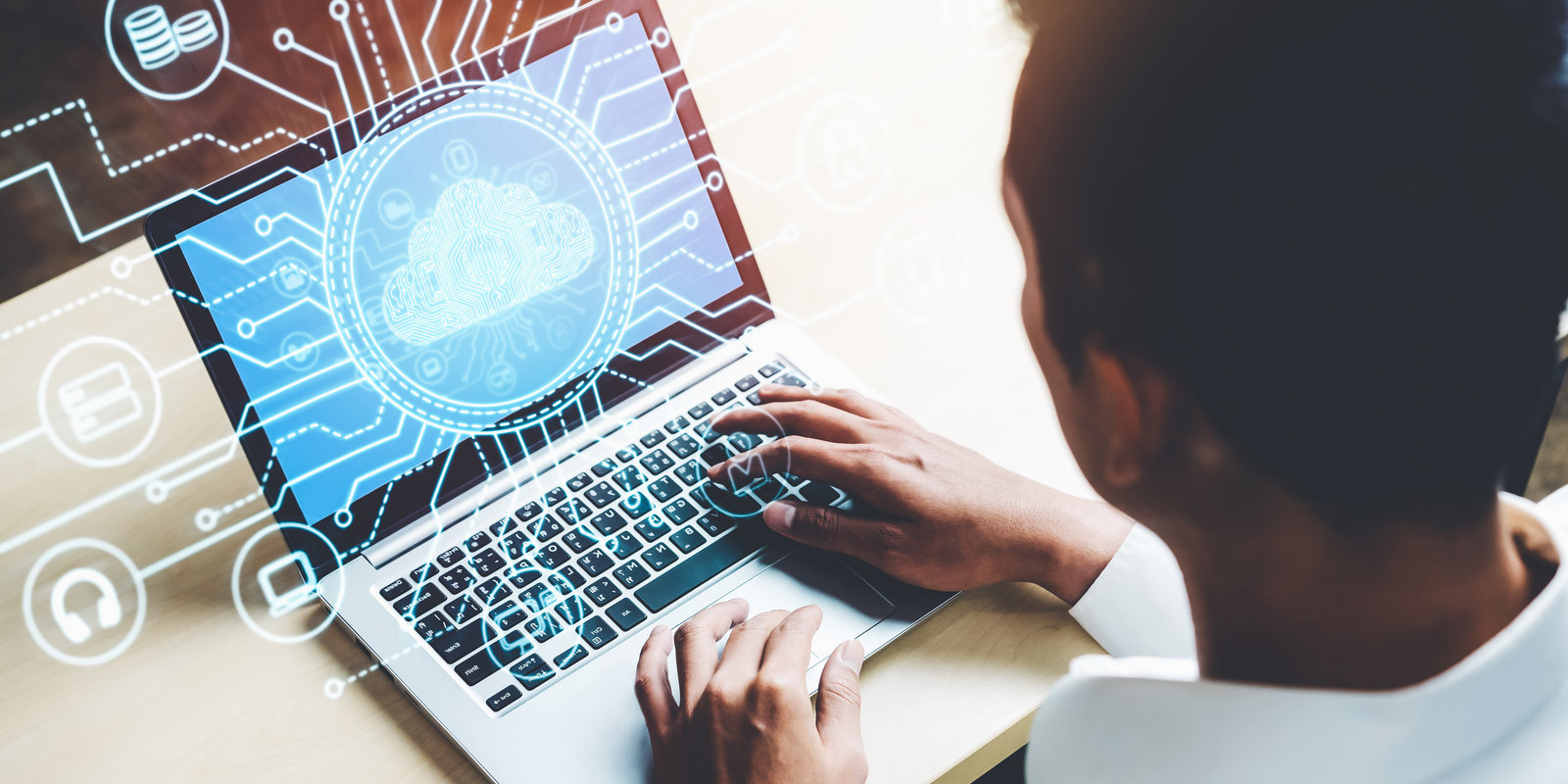 Man at computer using cloud based system